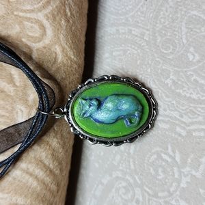 HANDMADE  Cat pendant green on a black ribbon necklace, silver toned frame. NEW!